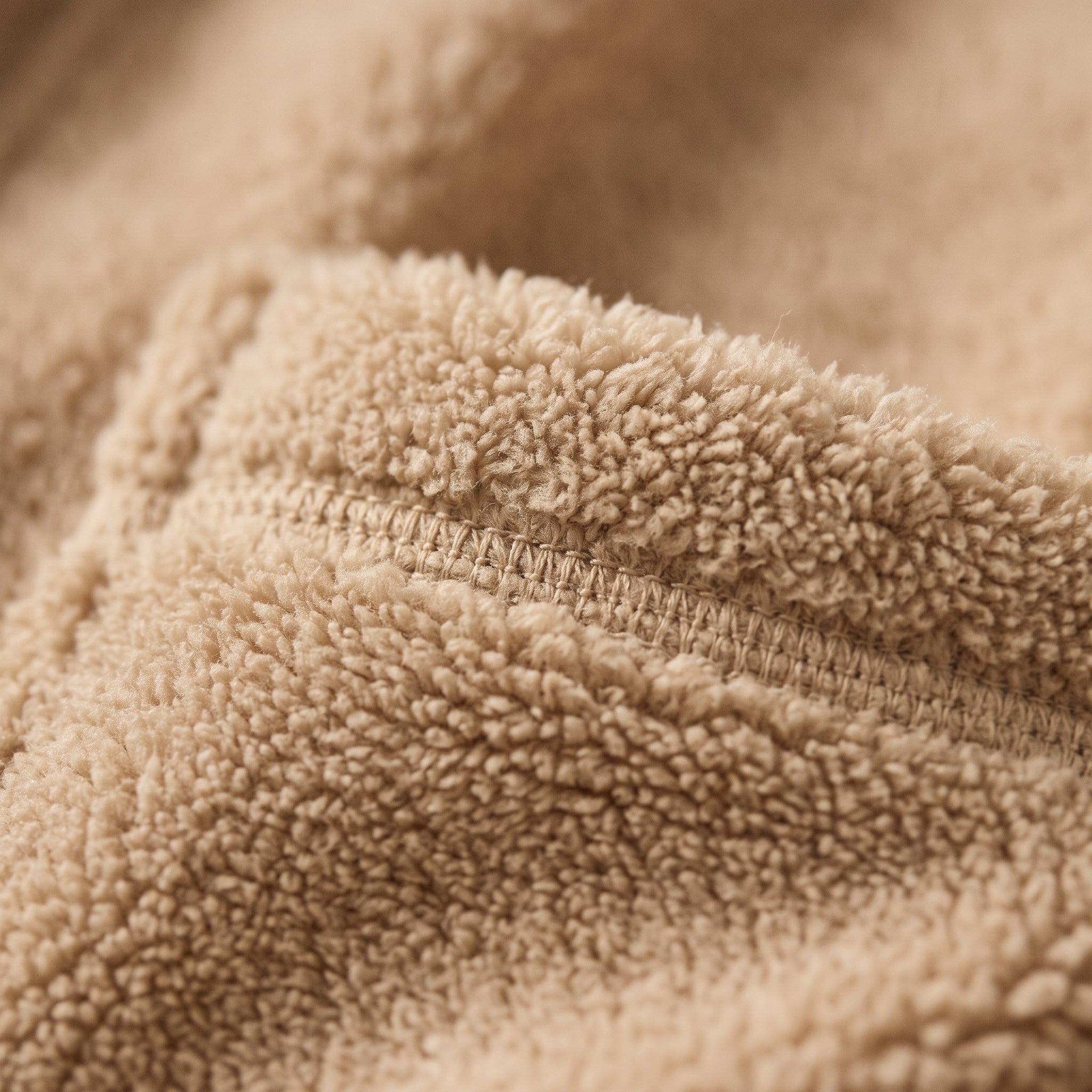 Gros plan macro texture peluche polaire du peignoir court beige Image