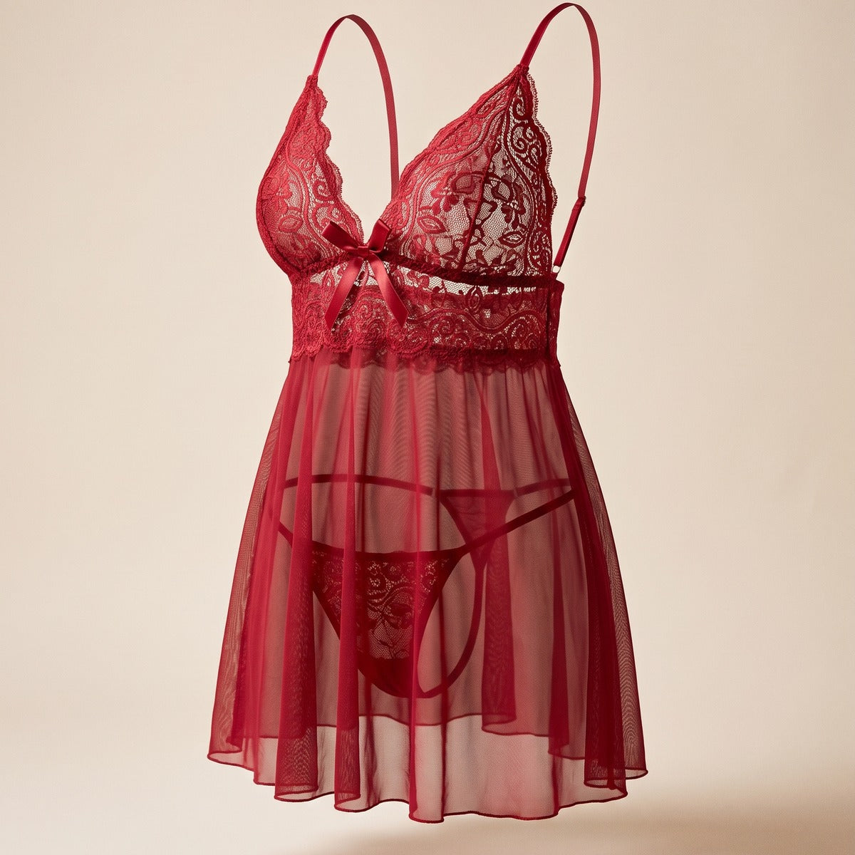 Nuisette rouge en dentelle portée, tombé du voile et coupe ajustée Image