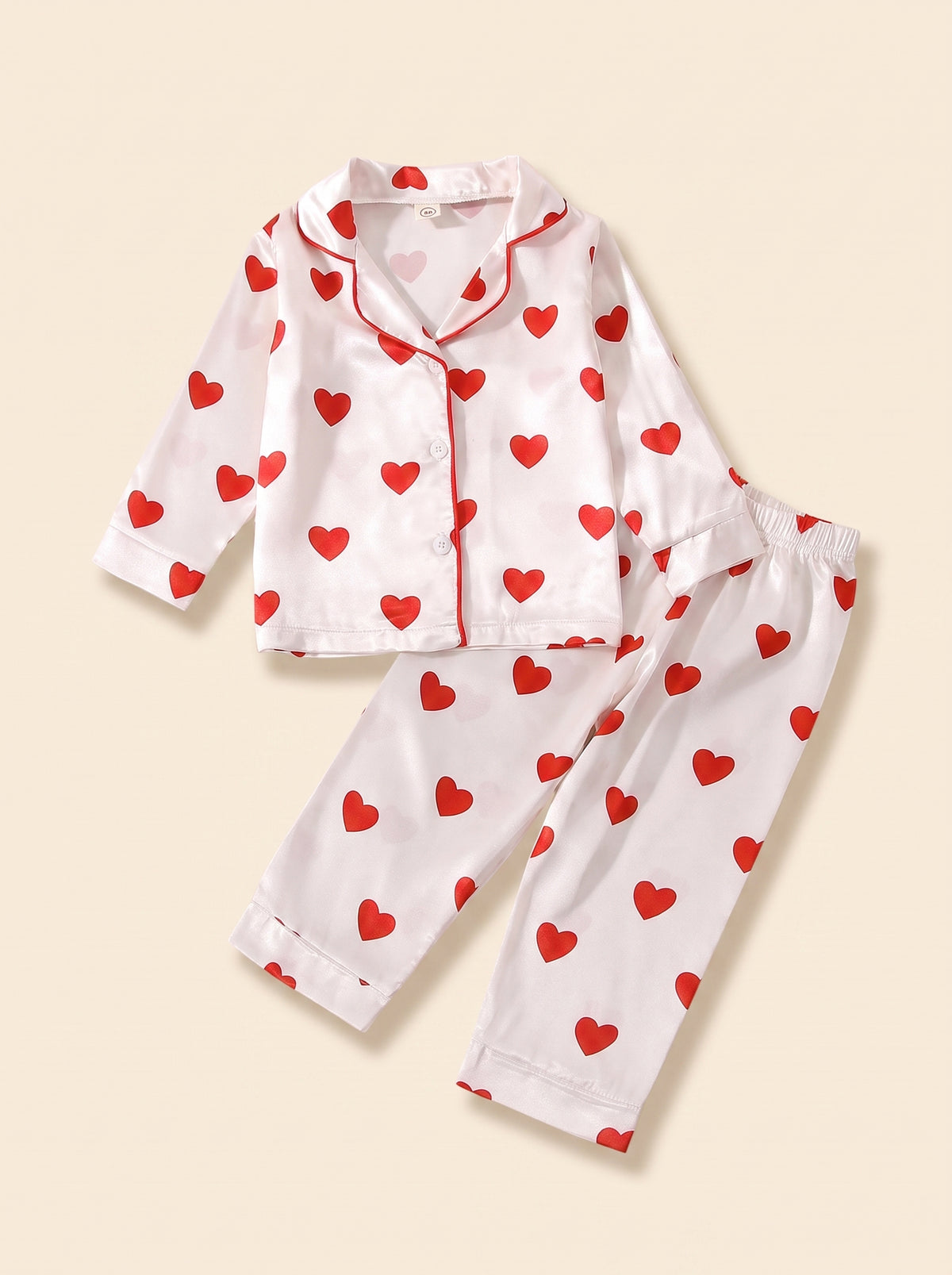 Pyjama bebe satine a coeurs rouges presente seul, effet mannequin invisible