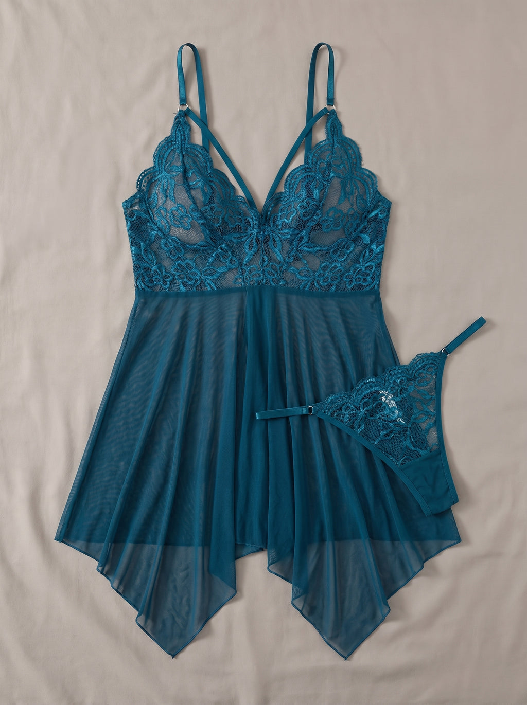 Nuisette babydoll transparente bleu canard et son string, à plat